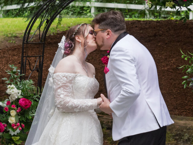 The first kiss of the bride and groom.