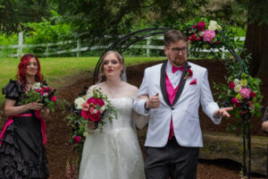 The bride and groom walking down the aisle at the end of the ceremony.